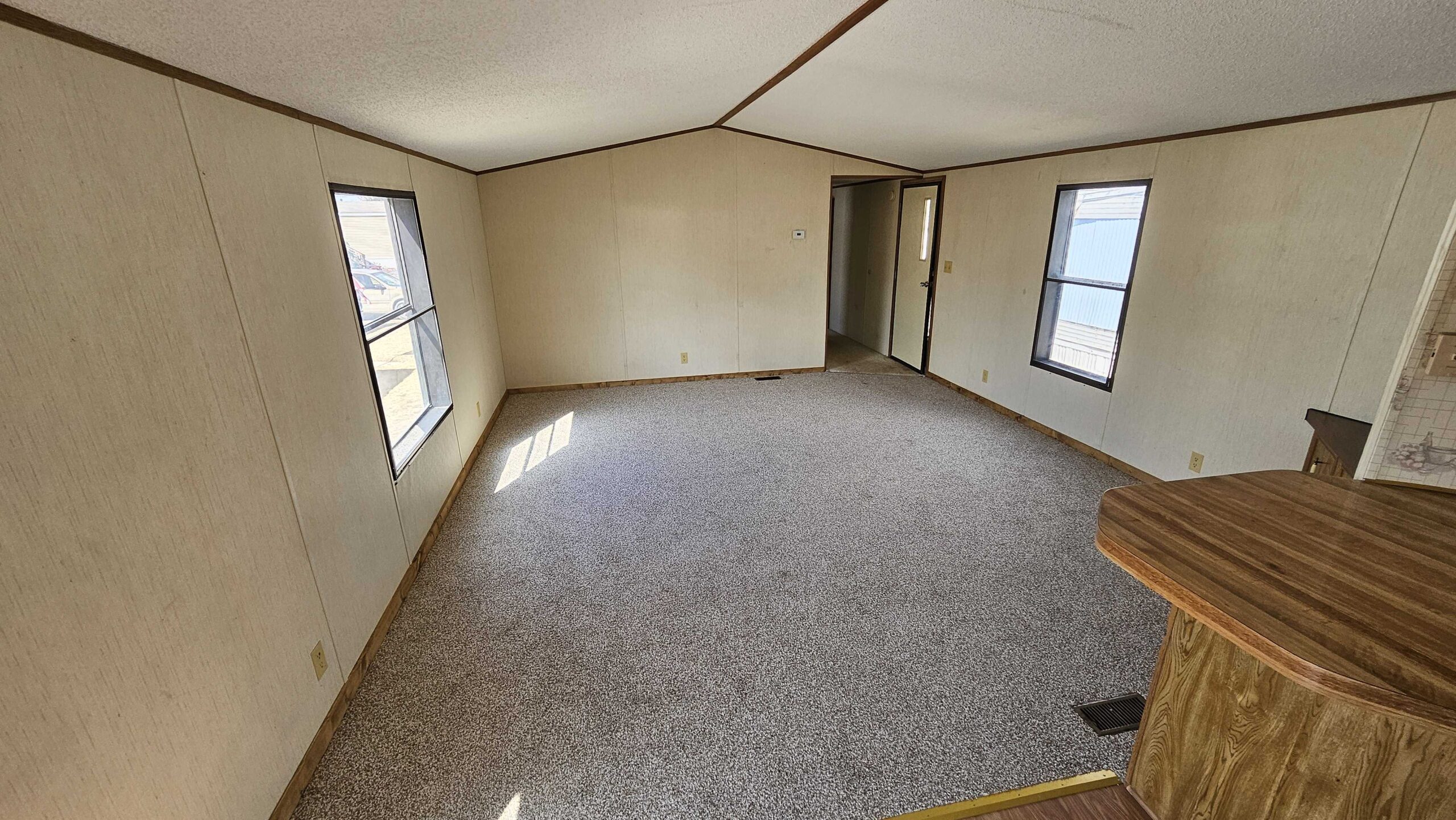 3-bedroom, 2-bathroom home for sale or rent in Eastside Mobile Home Park with ample storage and bright living spaces.