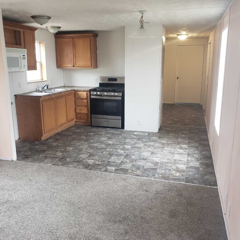 3-bedroom, 1-bathroom home for sale or rent-to-own in North Acres Mobile Home Park with bright and spacious interior and open space kitchen.