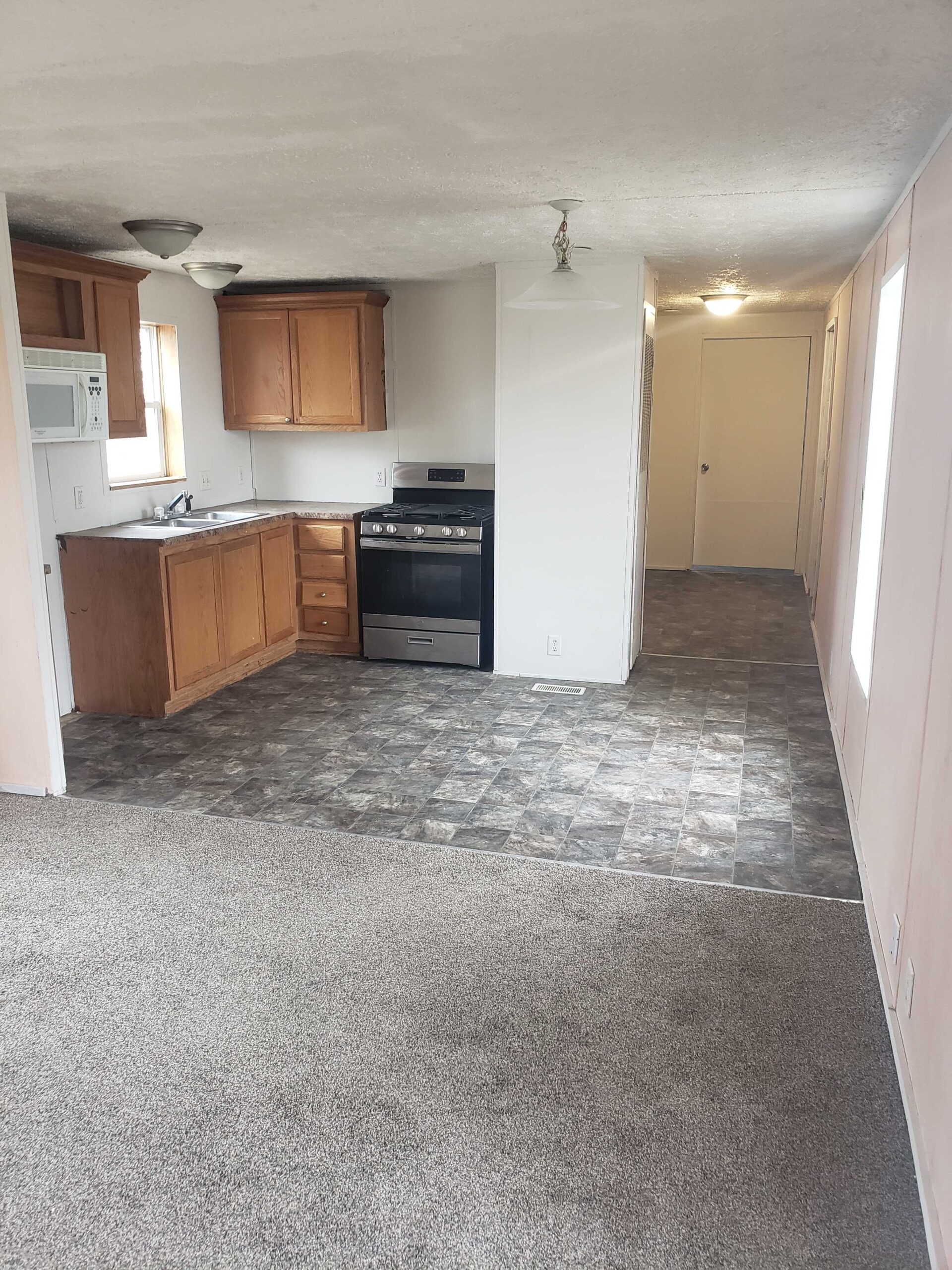 3-bedroom, 1-bathroom home for sale or rent-to-own in North Acres Mobile Home Park with bright and spacious interior and open space kitchen.