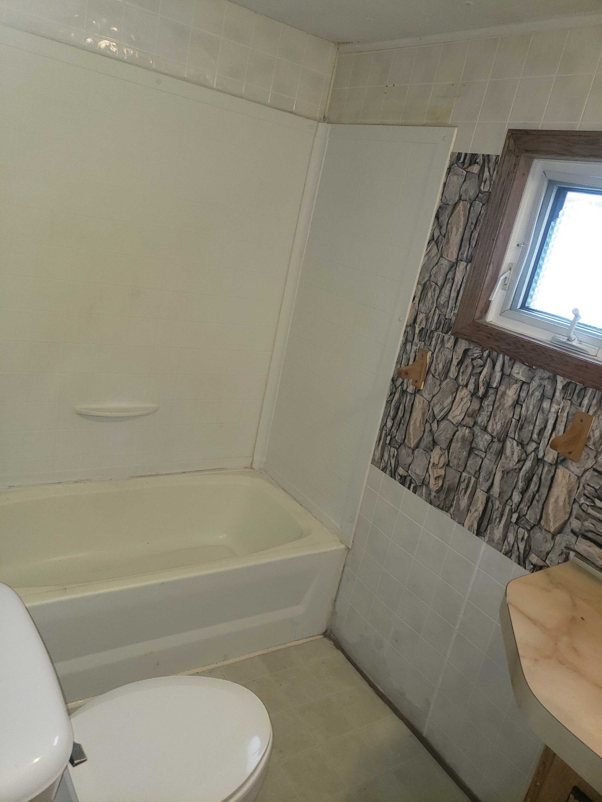 2-bedroom, 1-bathroom home for sale or rent-to-own in Carman Terrace Mobile Home Park with bright living spaces and a woody-like interior.