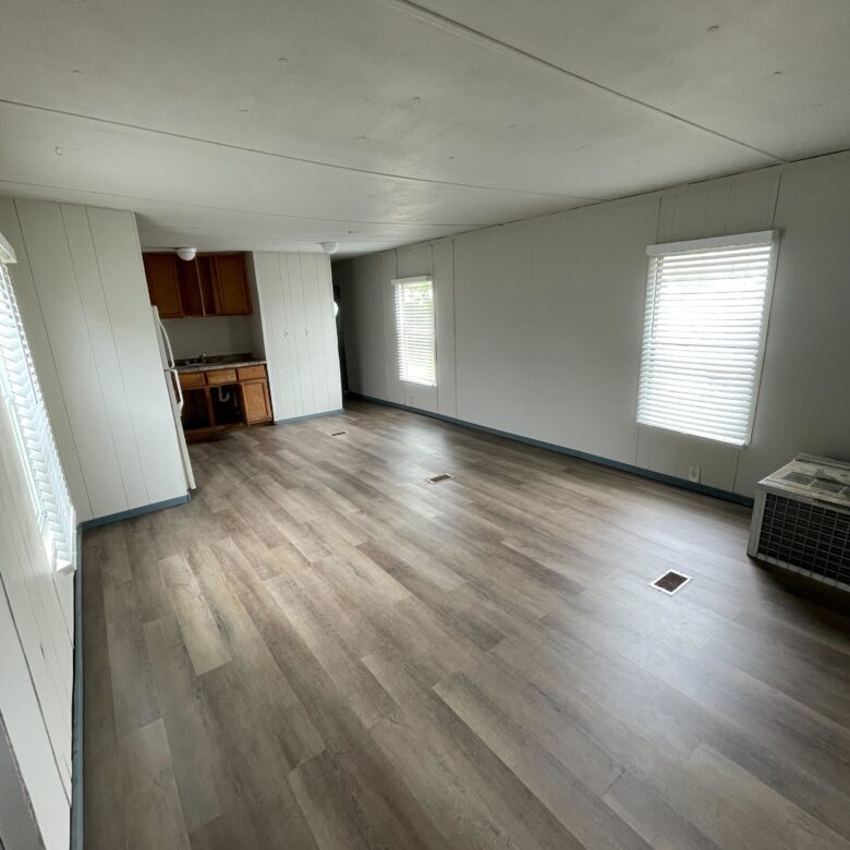 Newly renovated 2-bedroom, 1-bathroom home for sale in Columbia Mobile Home Park with bright living spaces and a well-equipped kitchen.