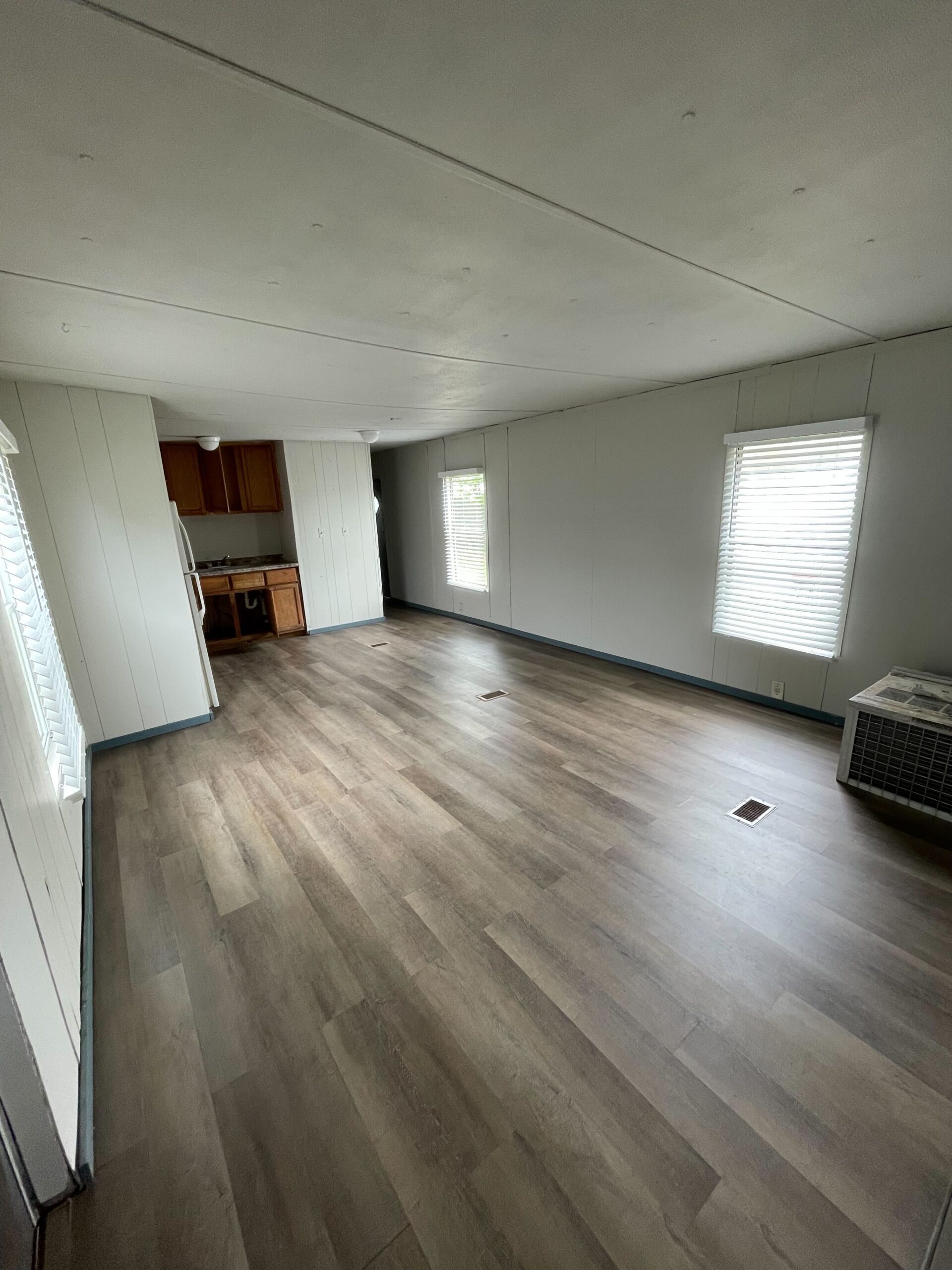 Newly renovated 2-bedroom, 1-bathroom home for sale in Columbia Mobile Home Park with bright living spaces and a well-equipped kitchen.