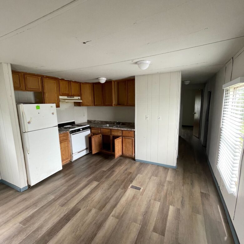 Newly renovated 2-bedroom, 1-bathroom home for sale in Columbia Mobile Home Park with bright living spaces and a well-equipped kitchen.
