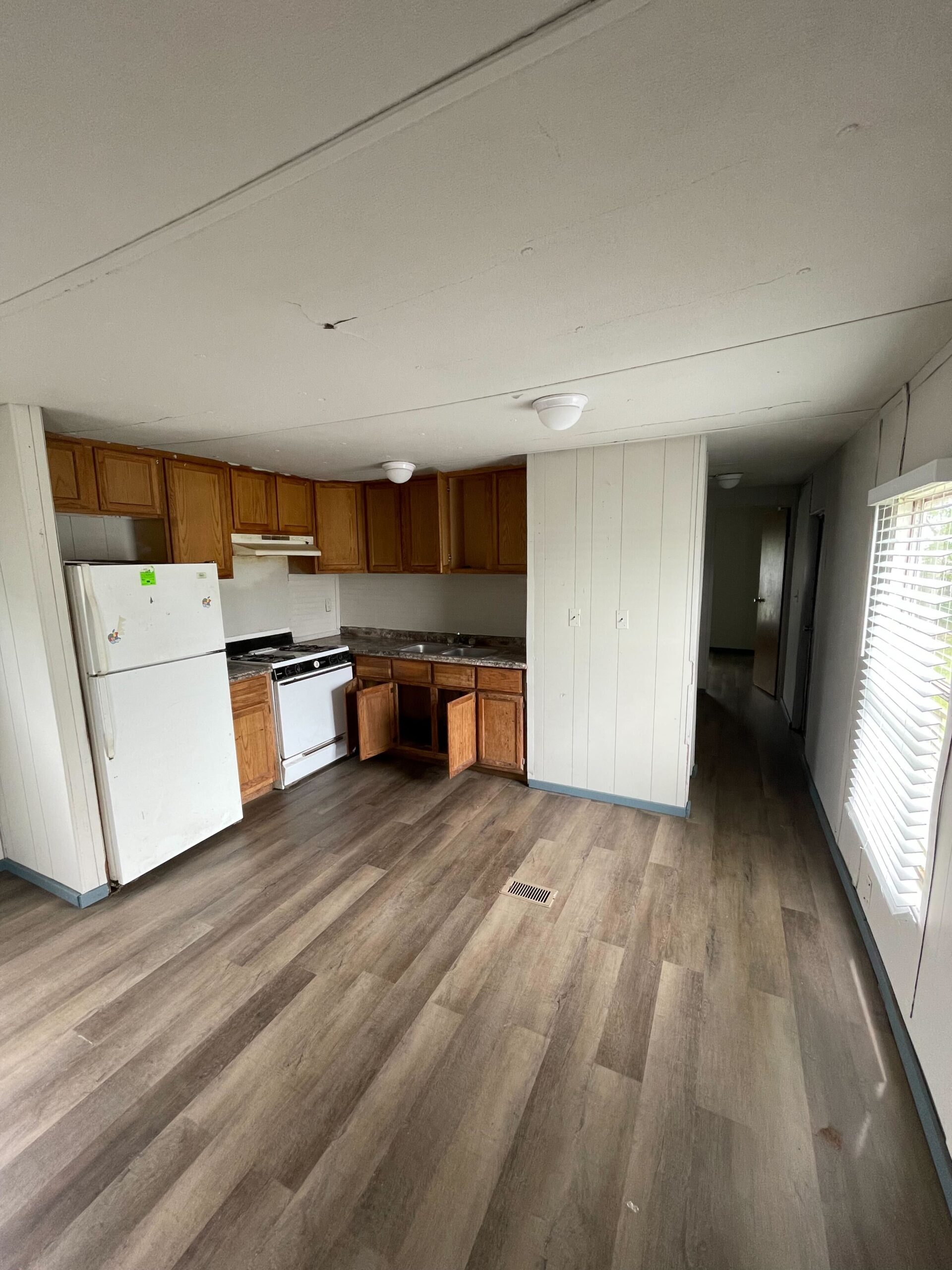 Newly renovated 2-bedroom, 1-bathroom home for sale in Columbia Mobile Home Park with bright living spaces and a well-equipped kitchen.