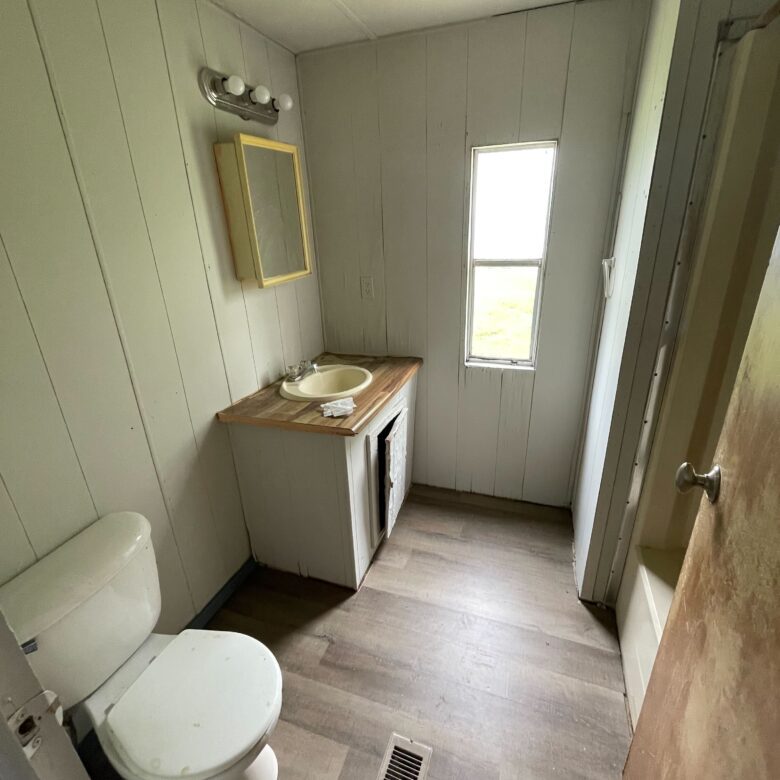 Newly renovated 2-bedroom, 1-bathroom home for sale in Columbia Mobile Home Park with bright living spaces and a well-equipped kitchen.