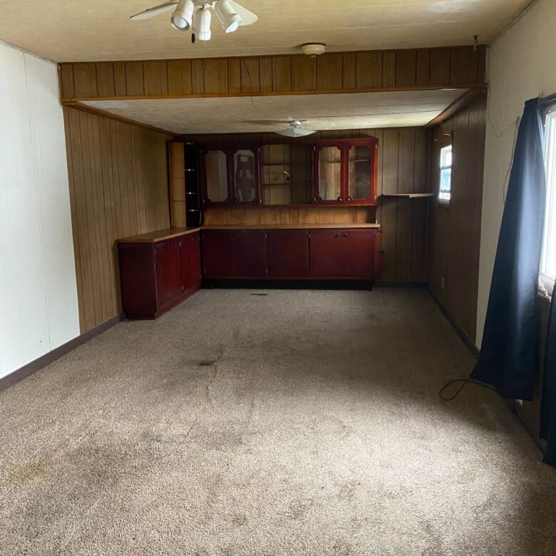 Cozy 1-bedroom, 1-bathroom home in Berne Mobile Home Park with bright living spaces and a woody-like interior