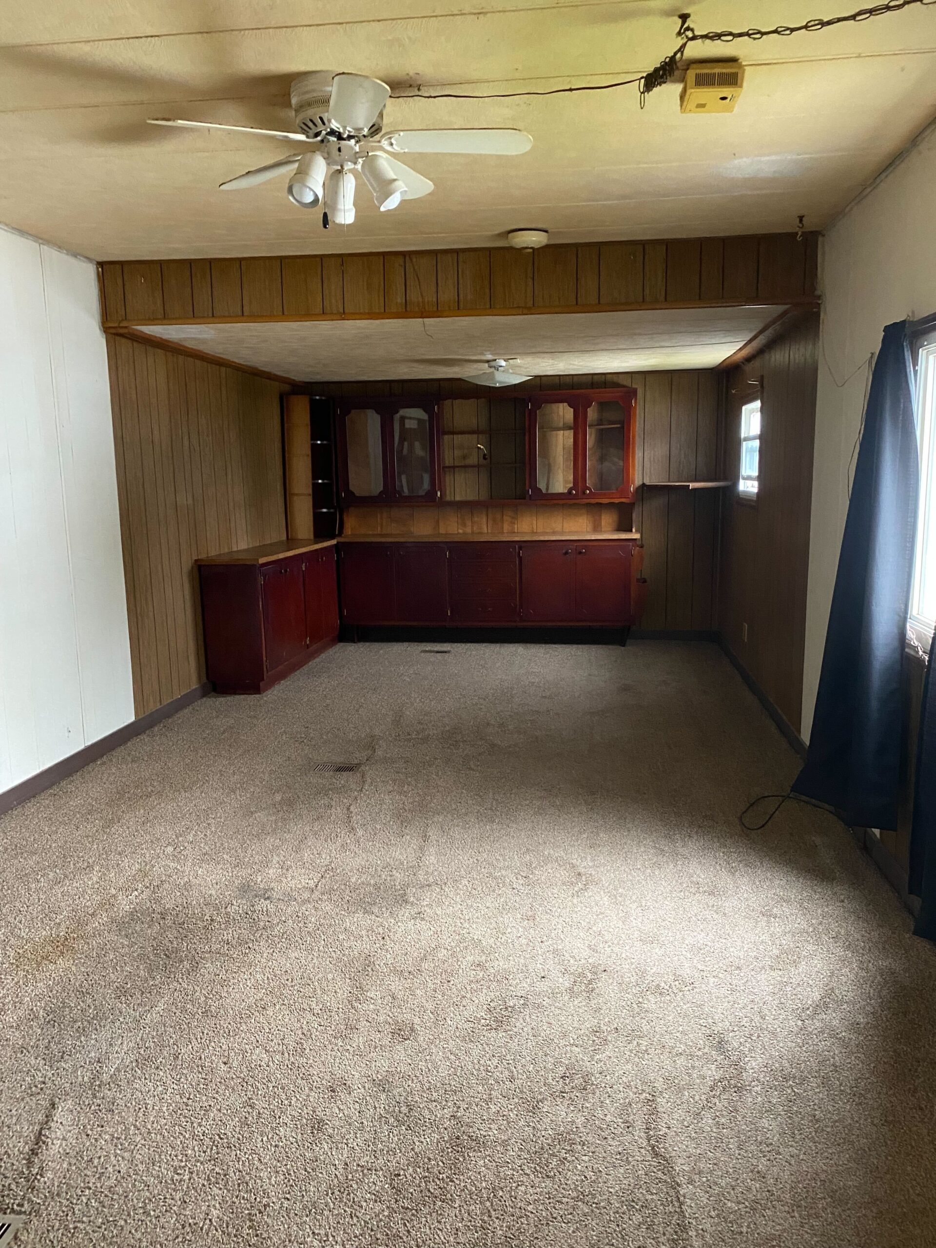 Cozy 1-bedroom, 1-bathroom home in Berne Mobile Home Park with bright living spaces and a woody-like interior