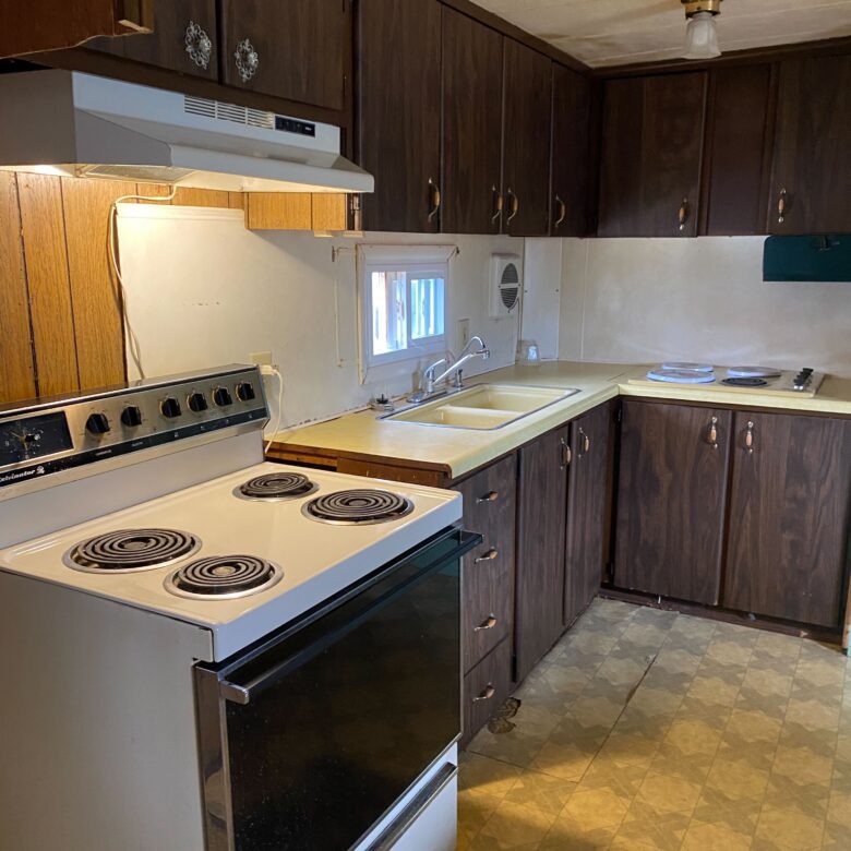 Cozy 1-bedroom, 1-bathroom home in Berne Mobile Home Park with bright living spaces and a woody-like interior