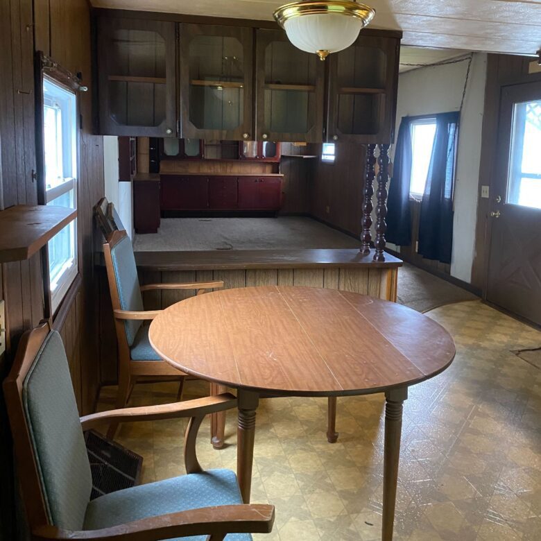 Cozy 1-bedroom, 1-bathroom home in Berne Mobile Home Park with bright living spaces and a woody-like interior
