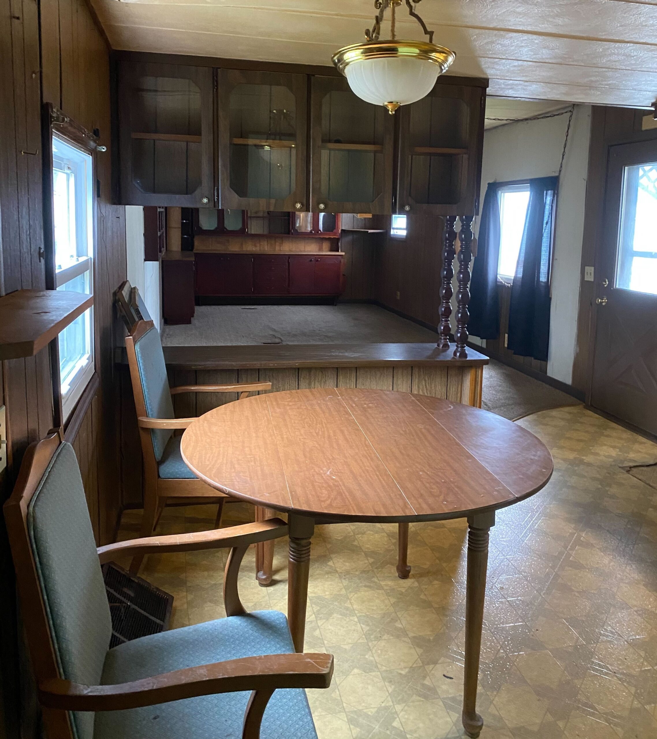 Cozy 1-bedroom, 1-bathroom home in Berne Mobile Home Park with bright living spaces and a woody-like interior