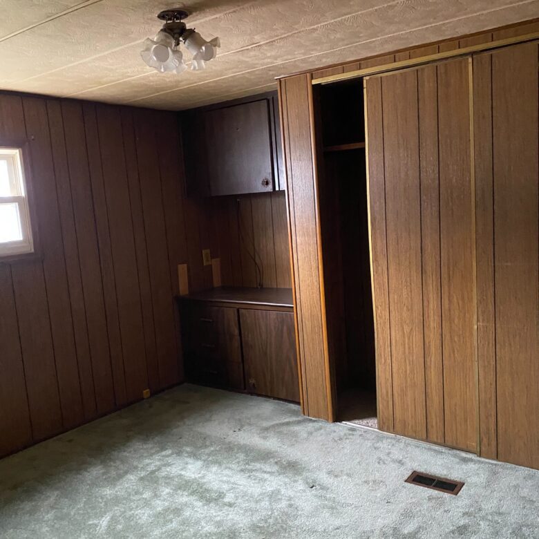 Cozy 1-bedroom, 1-bathroom home in Berne Mobile Home Park with bright living spaces and a woody-like interior