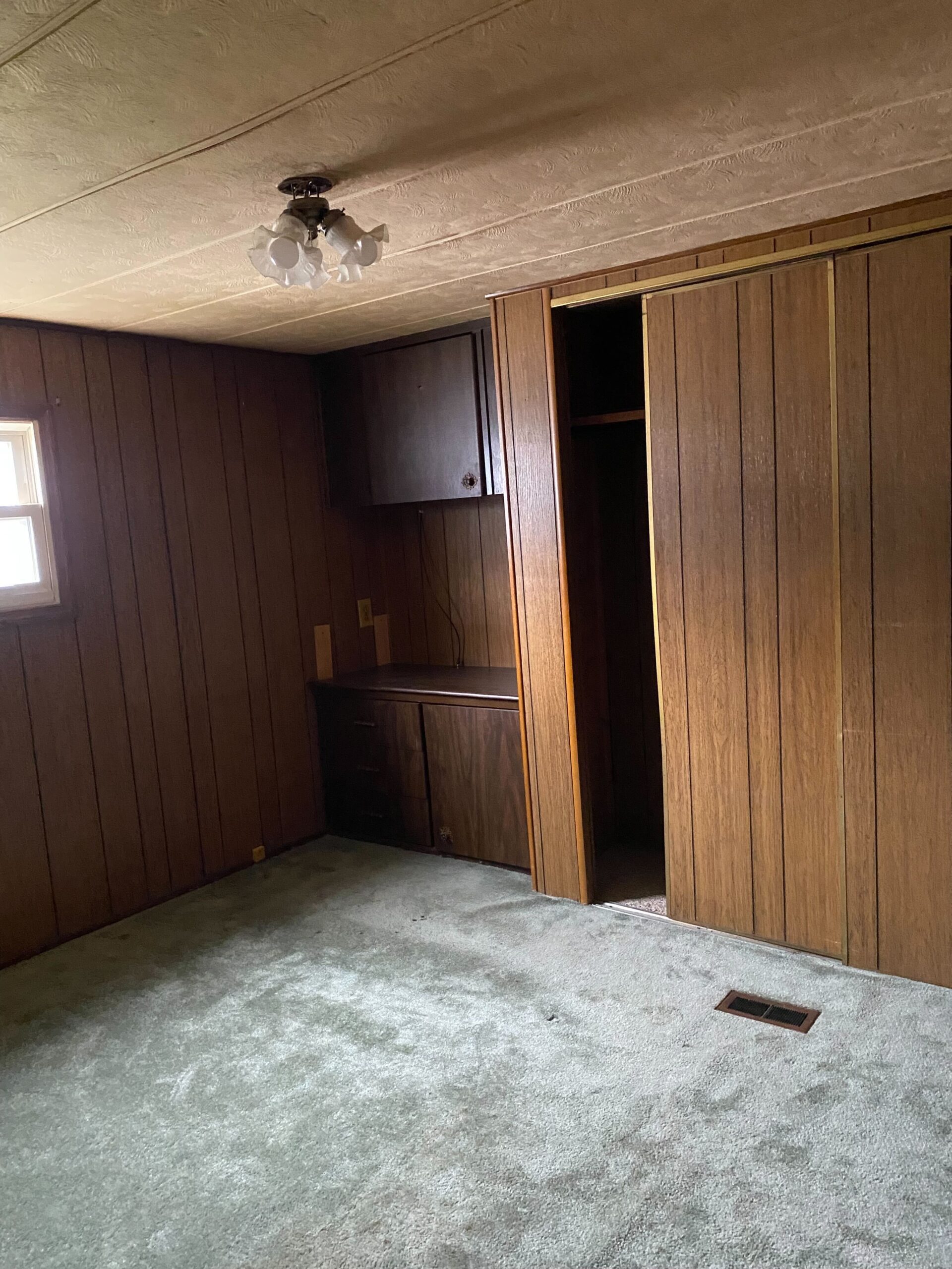 Cozy 1-bedroom, 1-bathroom home in Berne Mobile Home Park with bright living spaces and a woody-like interior