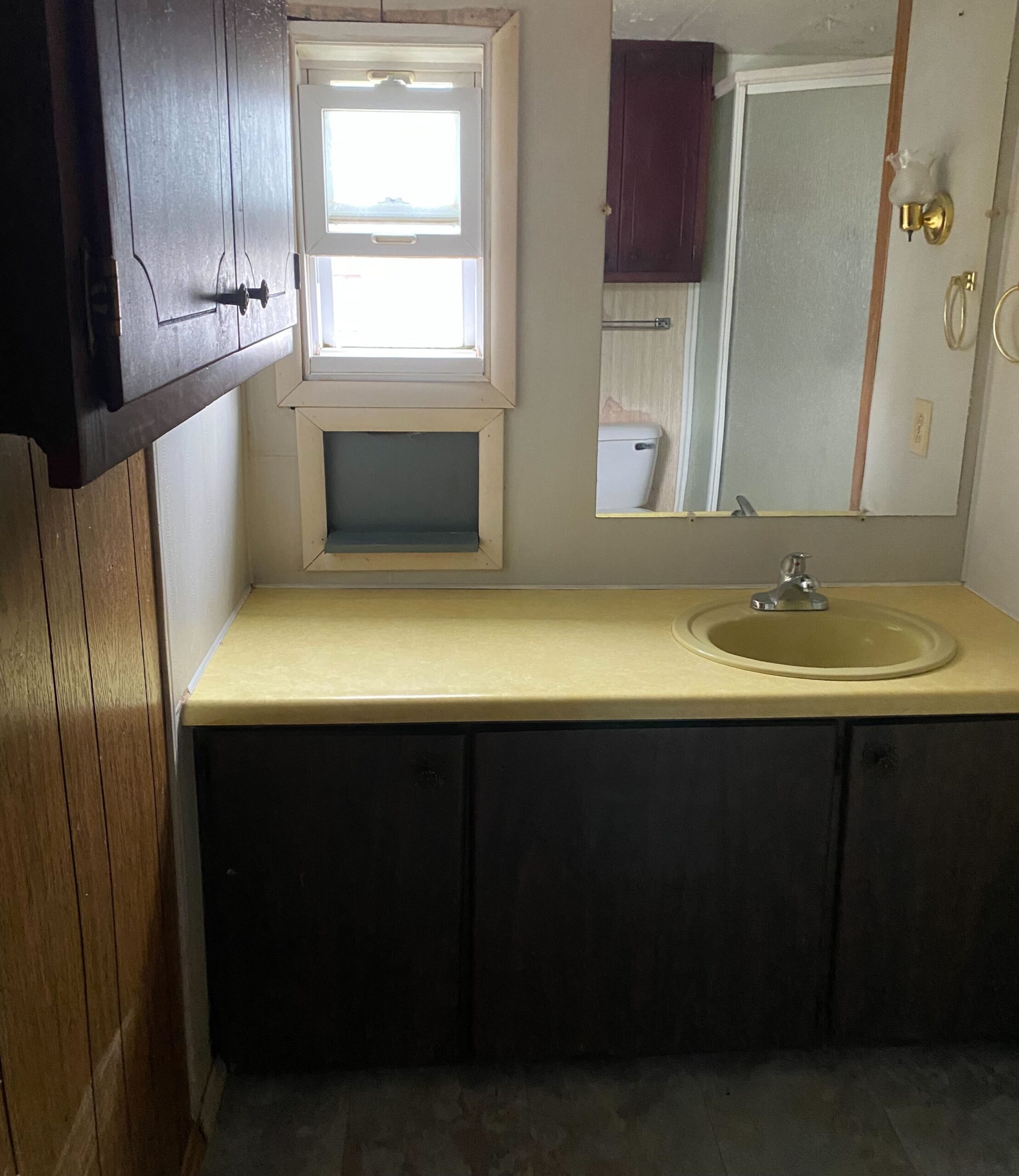 Cozy 1-bedroom, 1-bathroom home in Berne Mobile Home Park with bright living spaces and a woody-like interior