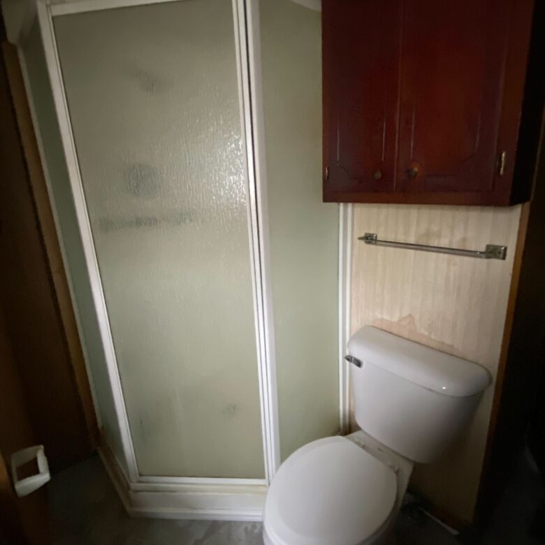 Cozy 1-bedroom, 1-bathroom home in Berne Mobile Home Park with bright living spaces and a woody-like interior
