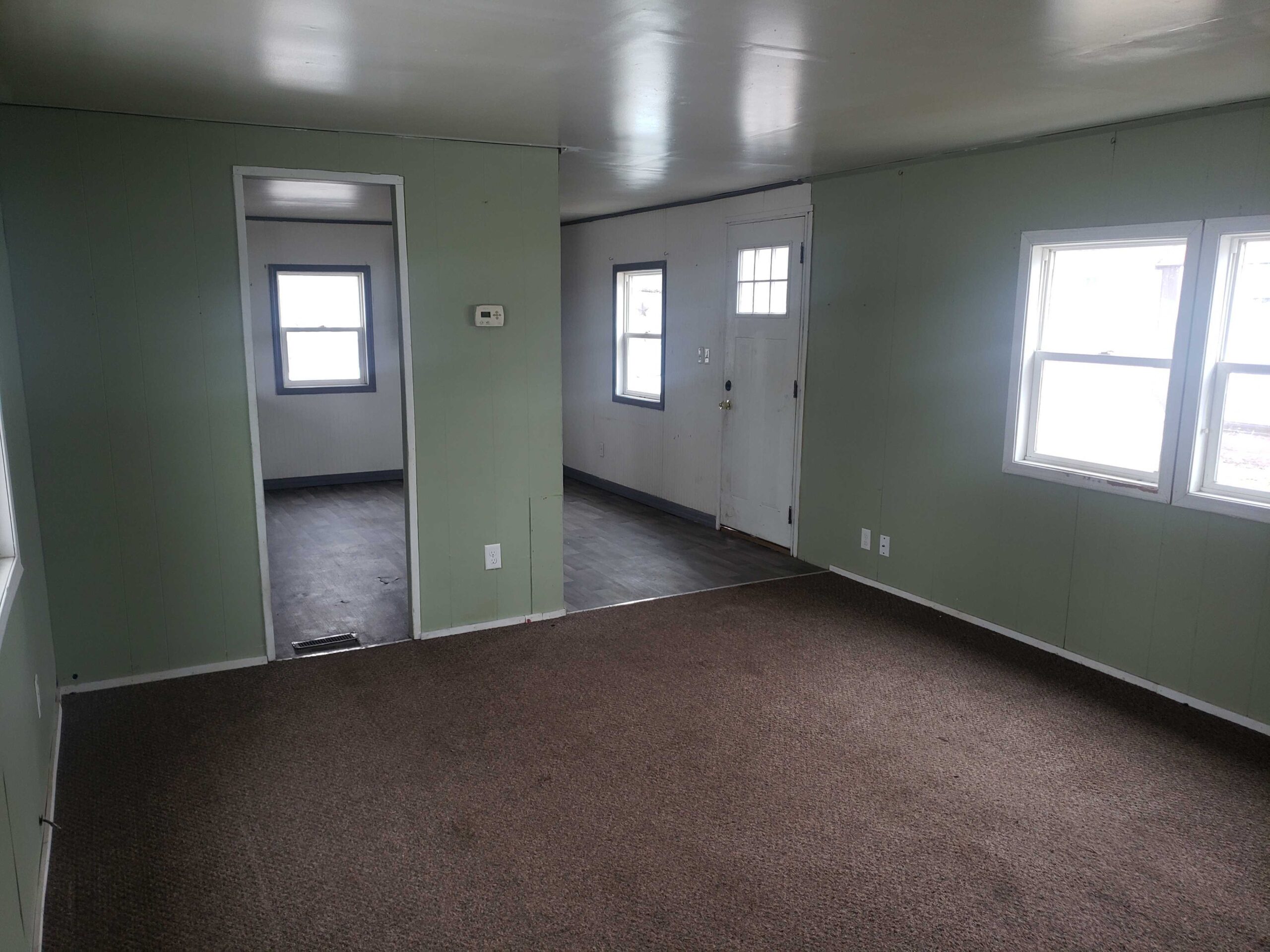 2-bedroom, 1-bathroom home for sale or rent-to-own in North Acres Mobile Home Park with ample storage and bright living spaces.