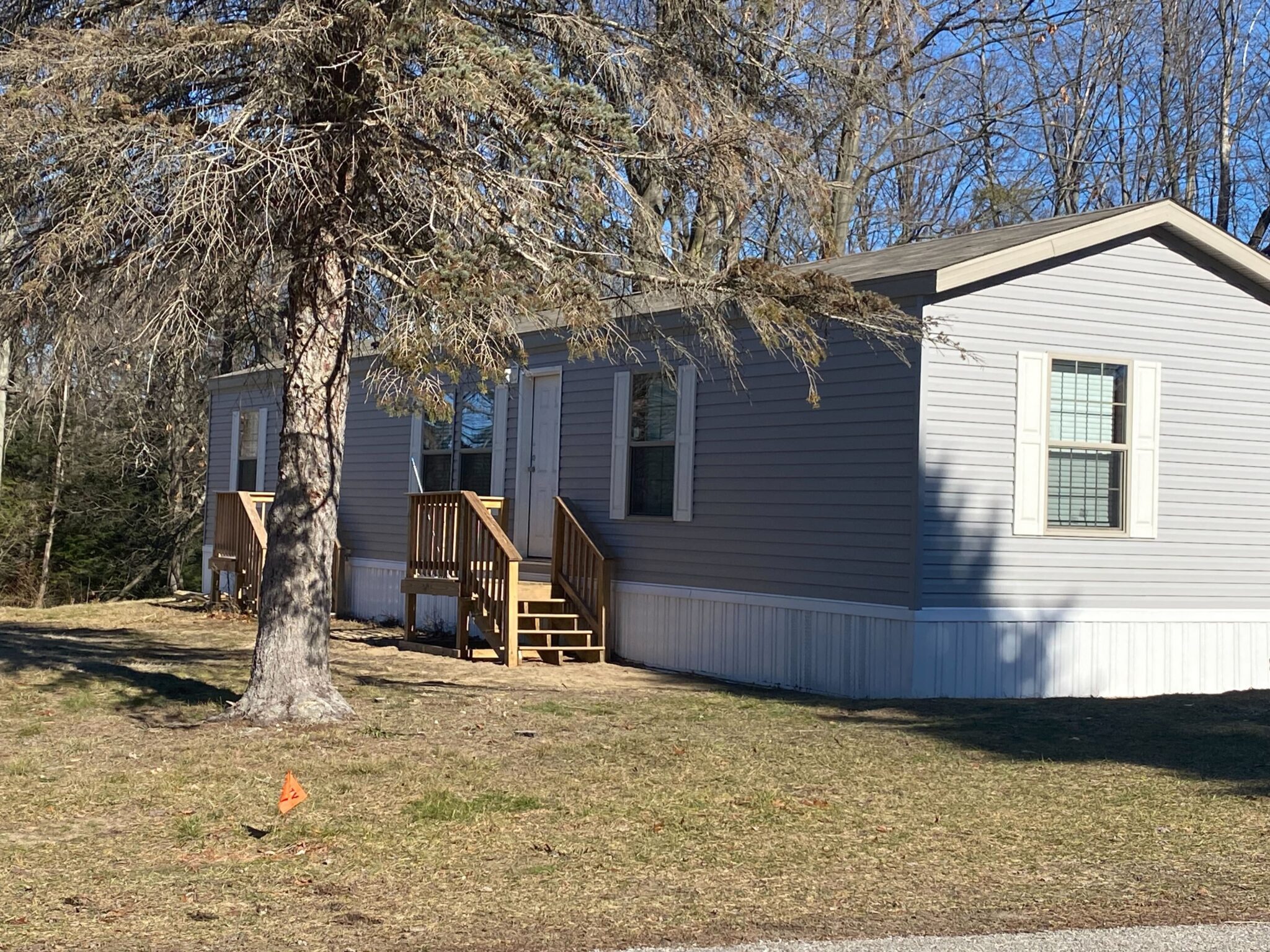 Ludington Mobile Home Park in Michigan with well-maintained mobile homes and lush surroundings